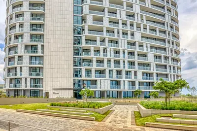 an apartment building with a garden in front of it at Belle Vue at Ellipse in Midrand