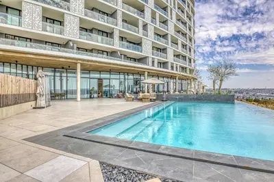 a swimming pool in front of a building at Bella Vista at Ellipse in Midrand
