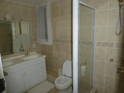 a bathroom with a toilet and a sink and a shower at Viva-Africa Zehetleitner in Pretoria