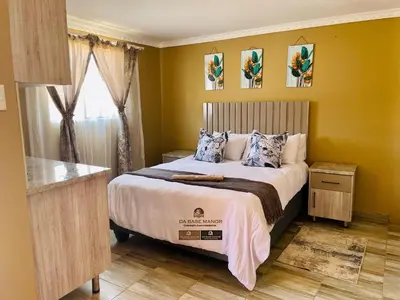 a bedroom with a bed and a window at Dabase manor