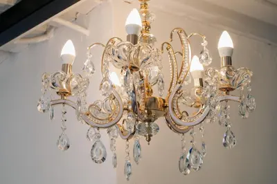 a gold chandelier hanging from a ceiling at La Grande in Benoni