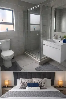 a bathroom with a shower and a toilet and a sink at The Blydes Crystal Lagoon in Pretoria