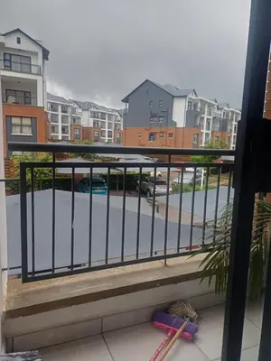a balcony with a view of a parking lot at The Blydes Crystal Lagoon in Pretoria