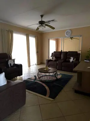 a living room with a couch and a table at Macibela2 in Bela-Bela