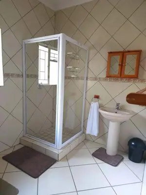 a bathroom with a shower and a sink at Macibela2 in Bela-Bela