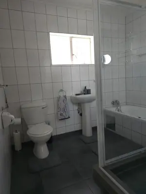 a bathroom with a toilet and a sink at Macibela2 in Bela-Bela