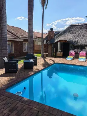 a swimming pool in the backyard of a house at Macibela2 in Bela-Bela