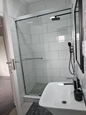 a bathroom with a shower and a sink at Lula Guest house 14km to Kriel power station in Kriel