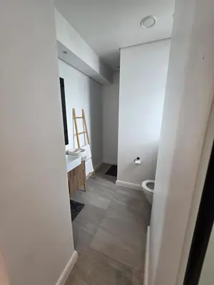 a bathroom with a toilet and a sink at Studio in Menlyn Maine in Pretoria