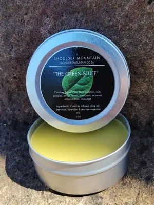 a tin of the green stuff in a container at A Farm Experience at Shoulder Mountain Products in Vaalwater