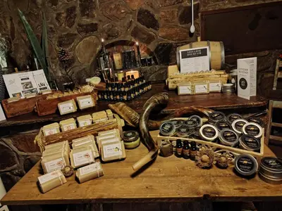 a table with a bunch of different items on it at A Farm Experience at Shoulder Mountain Products in Vaalwater