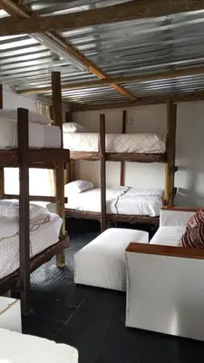 a room with a bunch of bunk beds at River Rock Safari Hebron, Kgabakatsane