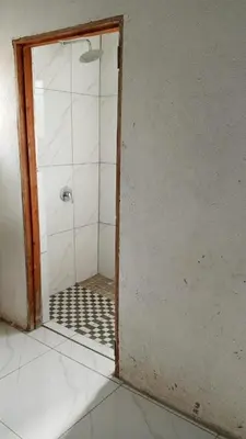 a shower with a glass door in a room at River Rock Safari Hebron, Kgabakatsane