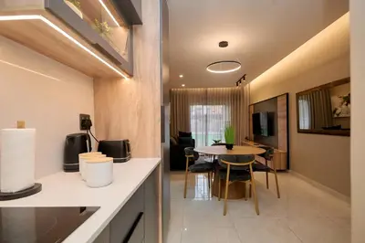 a kitchen with a table and a dining room at Unit 109 at Glen Park in Pretoria