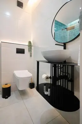 a bathroom with a sink and a mirror at Unit 109 at Glen Park in Pretoria