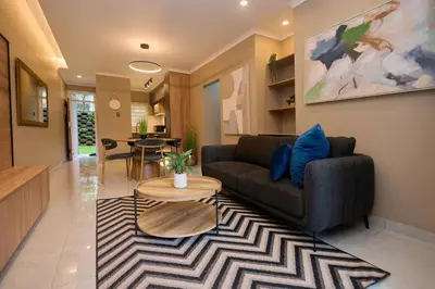 a living room with a couch and a table at Unit 109 at Glen Park in Pretoria
