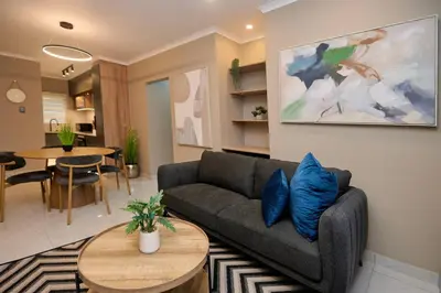 a living room with a couch and a table at Unit 109 at Glen Park in Pretoria