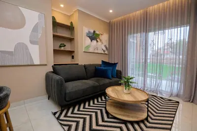 a living room with a couch and a table at Unit 109 at Glen Park in Pretoria