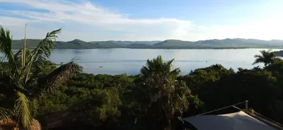 a view of a large body of water with trees at MiCasa in Hartbeespoort