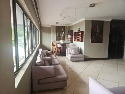 a living room with a couch and a table at MiCasa in Hartbeespoort