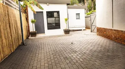 a brick driveway in front of a house at Thorne's crip in Pretoria