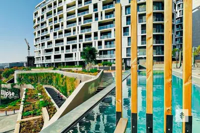 a building with a swimming pool in front of a building at Fezkho Boutique Stays in Midrand