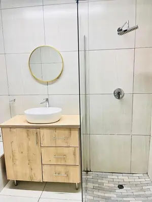 a bathroom with a sink and a shower at 43 Home Reyno Ridge in Witbank