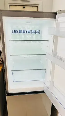 an empty refrigerator with its door open in a kitchen at Stylish 1 Bed Self Catering Near OR Tambo in Kempton Park