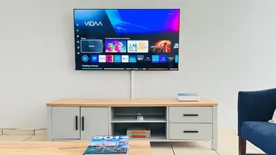 a living room with a tv on a wall at Stylish 1 Bed Self Catering Near OR Tambo in Kempton Park