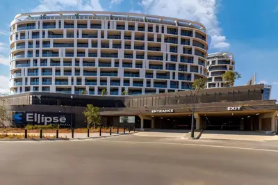 a large building with a parking lot in front of it at 4413 At Ellipse Waterfall in Midrand