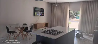 a kitchen with a stove and a table with chairs at Mupauli Boutique Lodge
