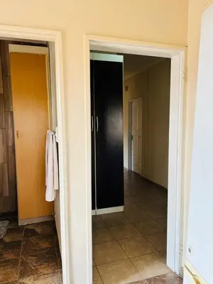 an open door to a hallway in a house at Bird & Bed Farmhouse in Brits