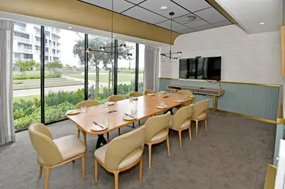 a conference room with a long table and chairs at Stylish Penthouse Studio in Ellipse Waterfall in Midrand