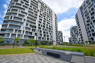 a large apartment building with two tall buildings at Stylish Penthouse Studio in Ellipse Waterfall in Midrand