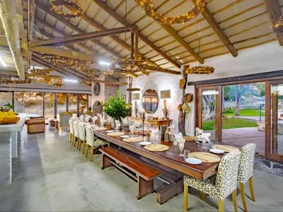 a large dining room with a long table and chairs at Dombeya Private Game Reserve in Vaalwater