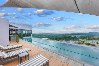 a view from the balcony of a building with a pool at Menlyn Main Apartments Trilogy Collection in Pretoria