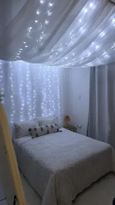a bedroom with a bed with lights on it at The village Executive Luxe Suites in Thohoyandou