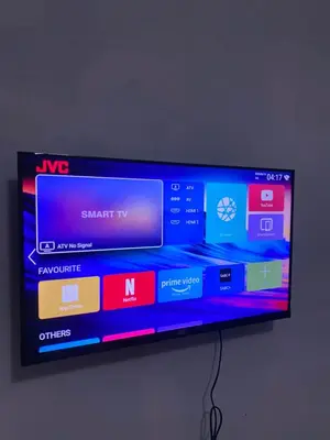 a flat screen tv hanging on a wall at Emangwevu Estate in Witbank