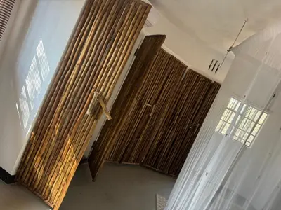 a church with wooden curtains and a cross on the wall at Villa Leopards Lookout in Marloth Park