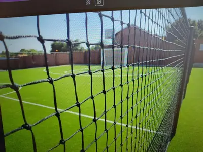 a view of a soccer field from behind a net at LSG Delta in Centurion