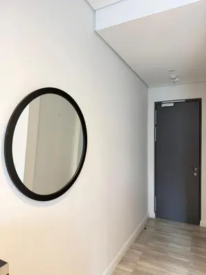 a mirror on a wall in a room with a door at Menlyn Maine Trilogy Apartments When Home is Far in Pretoria