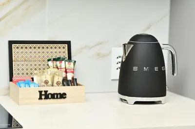 a juicer sitting on a counter next to a wooden box at Apartment in Menlyn Maine, The Capital Trilogy in Pretoria
