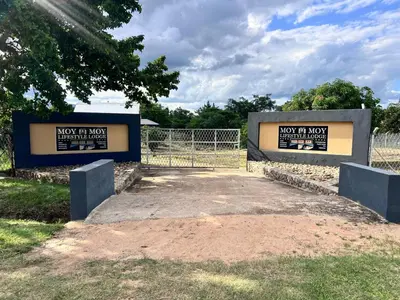 two signs that say not at now and a fence at MoyMoy Lifestyle Lodge in Meetse-a-Bophelo