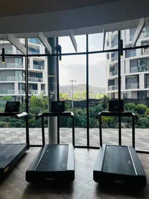 a room with three tables in front of a large window at Elegant Ellipse Waterfall Luxury with Gym, Spa & Dining in Midrand