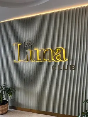 a yellow sign on the side of a building at Elegant Ellipse Waterfall Luxury with Gym, Spa & Dining in Midrand
