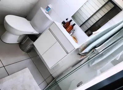 a bathroom with a toilet and a sink at Cozy Corner in Midrand