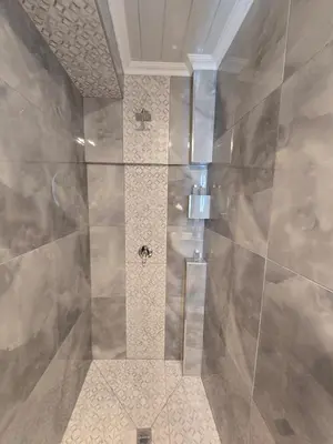 a bathroom with a shower with two bees on the wall at Cozy Cove Midrand in Midrand