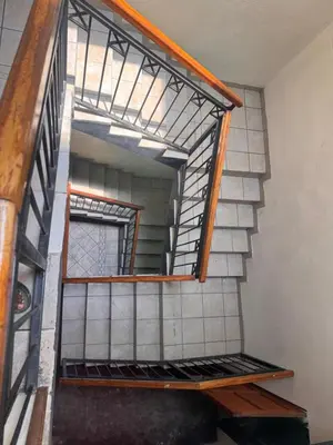 a set of stairs in a room with a window at Airport Lodge Hotel in Kempton Park