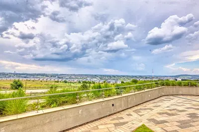 a balcony with a view of a city at Nova Luxe Midrand Waterfall Ellipse Galileo in Midrand