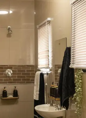 a bathroom with a sink and a mirror at Thorne's crip in Pretoria